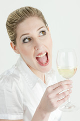 portrait of young woman with a glass of white wine