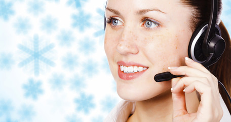 Girl with headset against winter background with snowflakes
