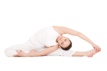 Young woman doing yoga exercise