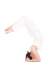 Young woman doing yoga exercise
