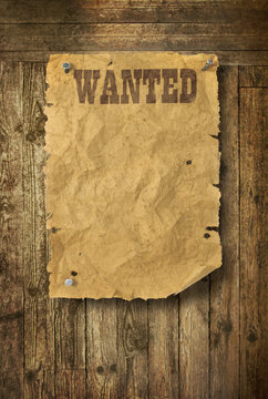 Wild West wanted poster on old wooden wall