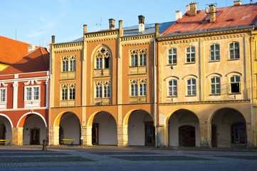 Fototapeta na wymiar Apartment houses on town square in Jicin, Czech Repubilc