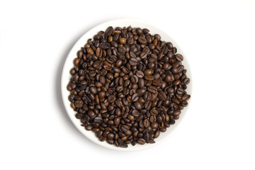 Coffee beans on the white plate