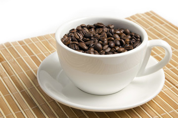 Fototapeta na wymiar Coffee beans in the white cup