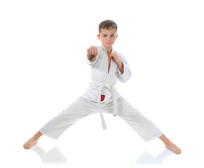 Young boy training karate.