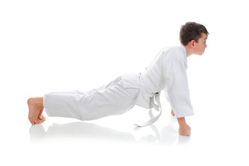 Young boy training karate.