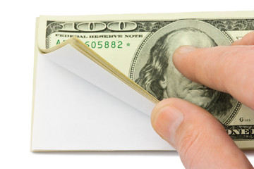 Hand and wad of paper