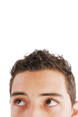 Young trendy businessman looking up. Isolated against white back