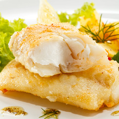 Fish dish - fried fish fillets and vegetables