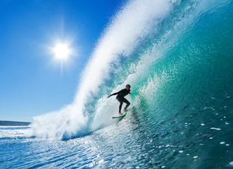 Fototapeten Surfer auf Blue Ocean Wave © EpicStockMedia