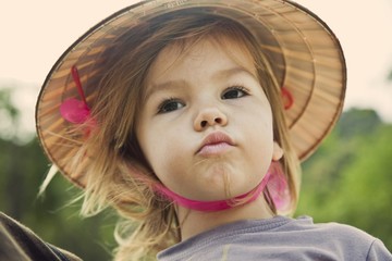 Baby girl in Vietnam's hat