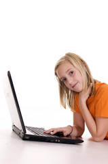 Fototapeta premium young girl lying with laptop