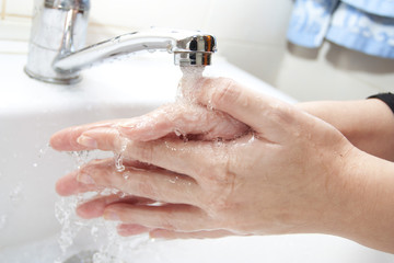 Washing of hands with soap