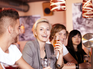 Friends in a pub enjoy nightlife