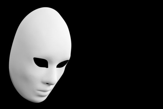 Venetian white mask. Black background.