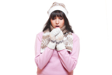 woman in hat and scarf warm oneself