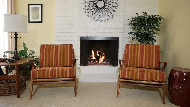 Chairs next to fireplace in residential home