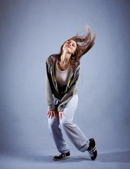 Fototapeta na wymiar Teenage girl dancing hip-hop studio series