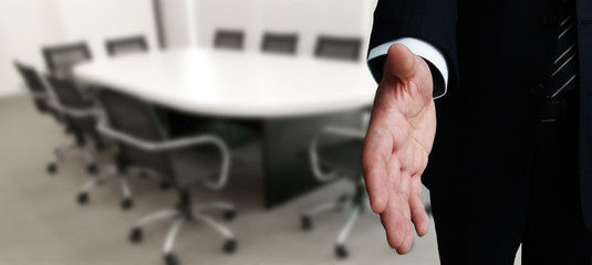 Business man stretching hand for a shake