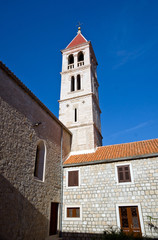 Fototapeta na wymiar Old church belltower in ancient village of Croatia.