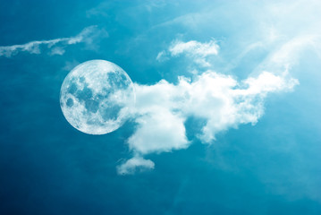 Moon between the clouds