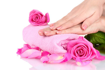 Pink towel with roses and hands on white background