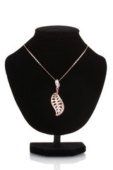 Pendant in form of leaf on mannequin isolated on white
