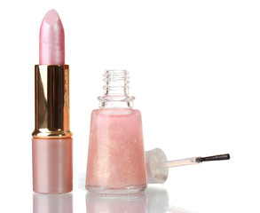 Pink lipstick and beige nail polish with sparkles isolated