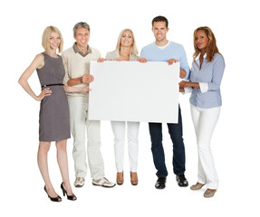 Casual group of people holding a billboard