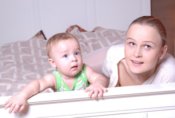 Mother and child are watching tv, family scenes