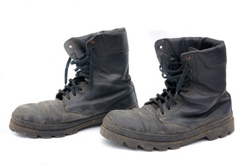 Old army boots on a white background