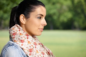Portrait of young woman in park