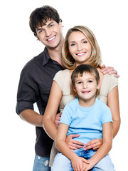 Happy young family with  child - isolated