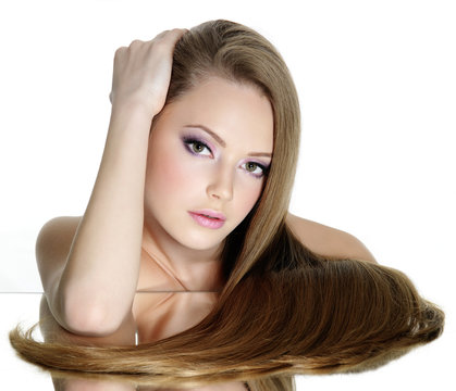 Portrait of beautiful young woman with long straight hair