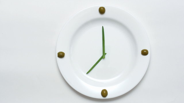 Olives, green onions, a plate - clock