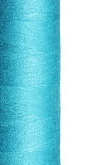 Blue bobbin thread isolated on white