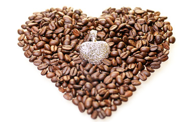 Heart shape coffee beans with a silver pendant