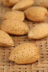 Closeup of Almonds Shells on wooden background