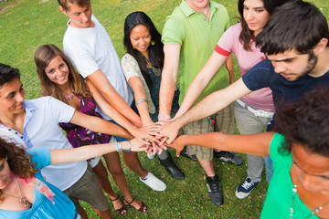 Happy Teenage Group with Hands on Stack