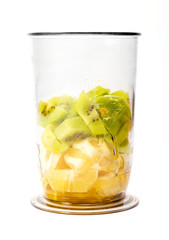 Pieces of kiwi and orange in plastic cup