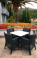 hotel terrace with table and chairs