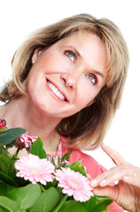 Happy senior woman with flowers.