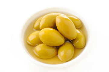 Pickled olives in a white cup