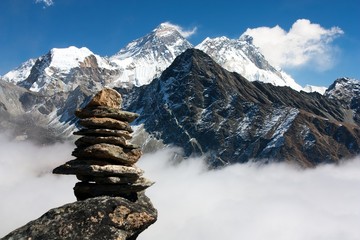 view of everest with stone man from gokyo ri