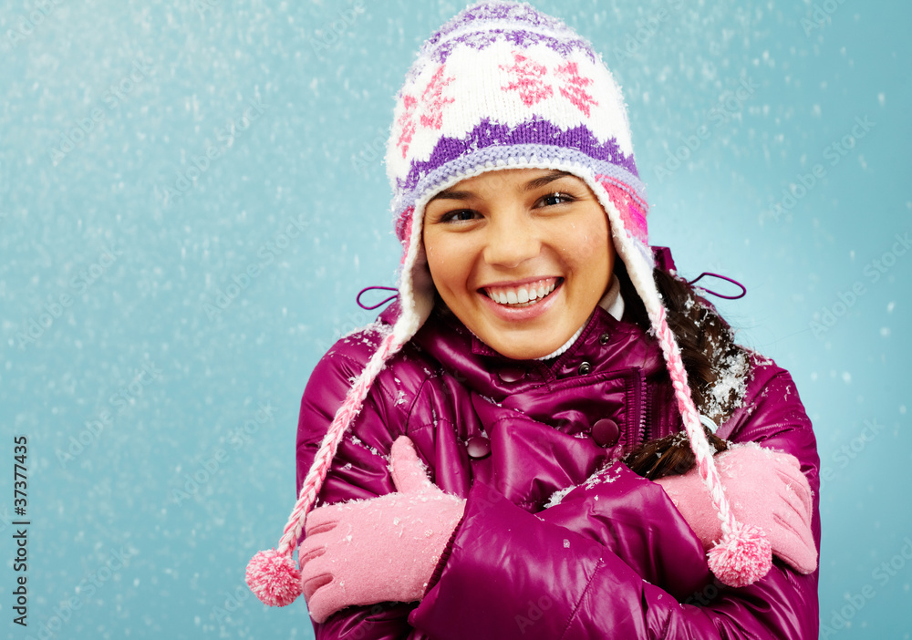 Wall mural Smiling girl in winter