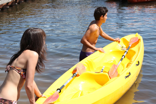 Young couple with boat