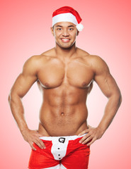 A man  in a Santa uniform against traditional background