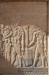 Egyptian engraved gods image on wall in Kom Ombo temple, Egypt