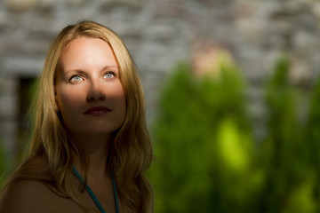 Naklejka premium Blonde Caucasian Woman with Upper Face Lit