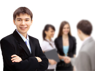 Business man with colleagues out of focus in